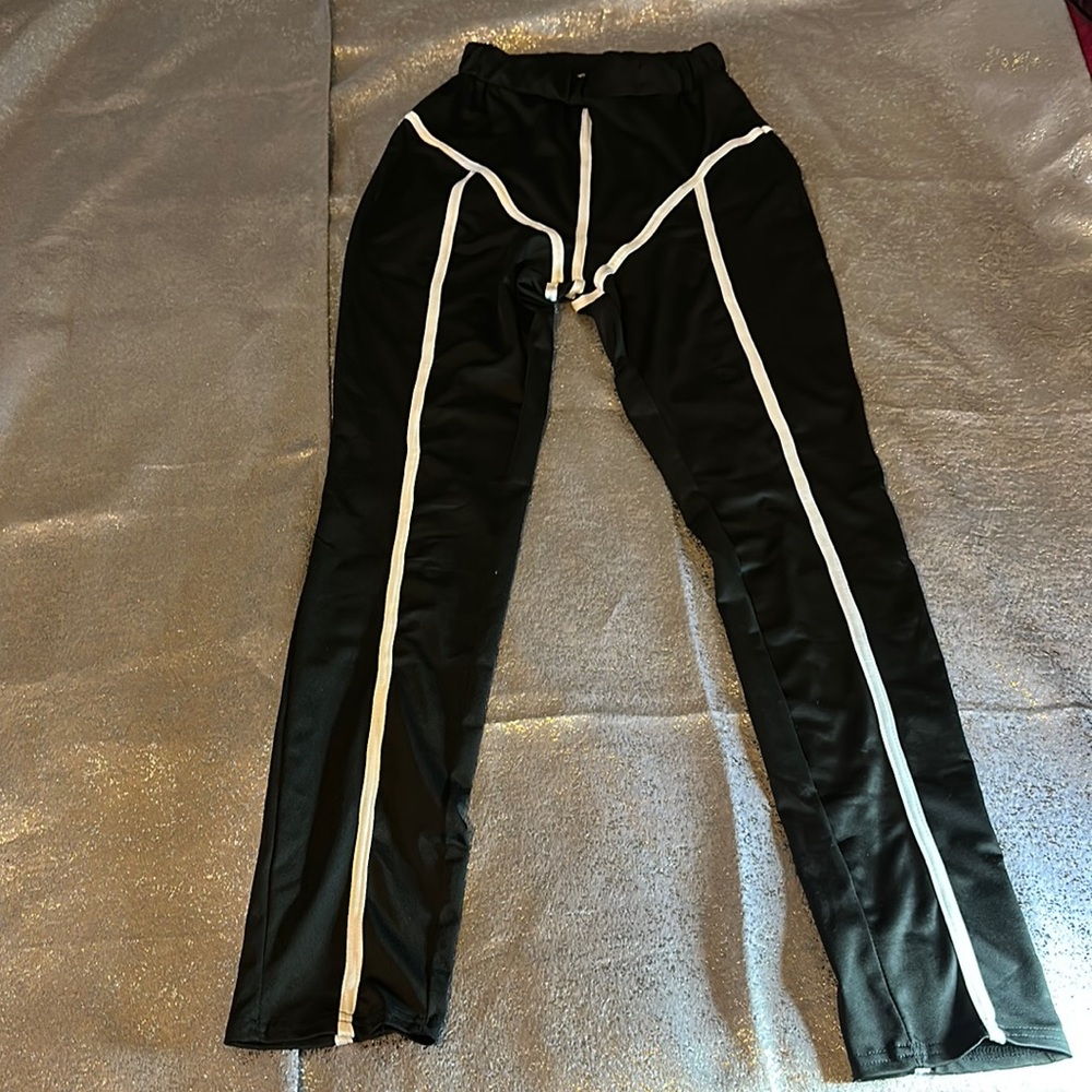 Black track pants with white stripes .. size Medium-Large No Name